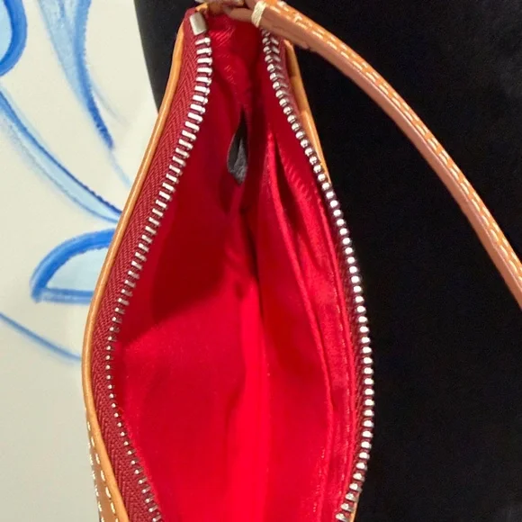 Dooney & Bourke Black and Tan Pebbled Leather Wristlet with Tassel - Picture 4 of 5